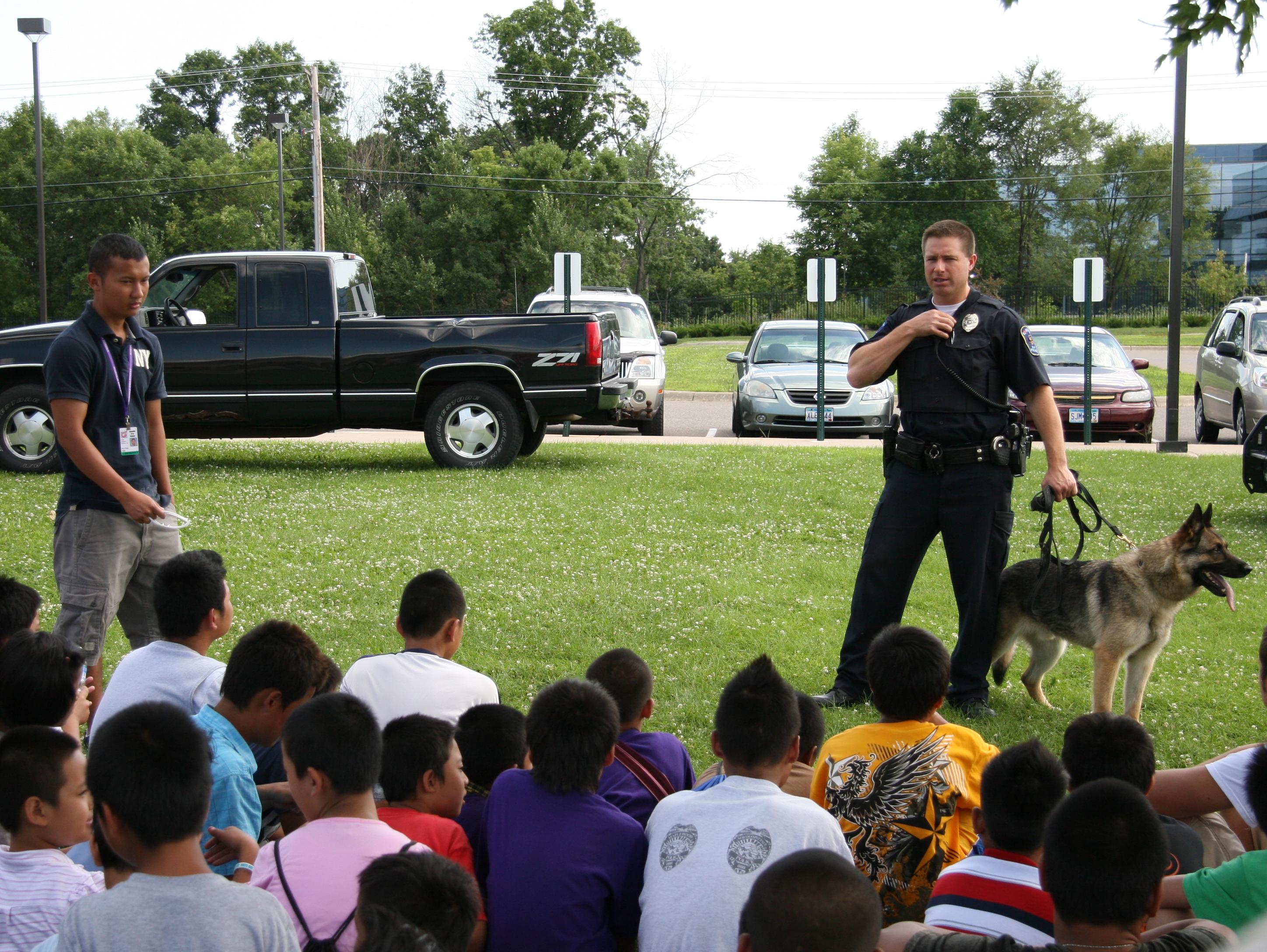 Officer Gray and Tasco providing a K9 demo during a summer program