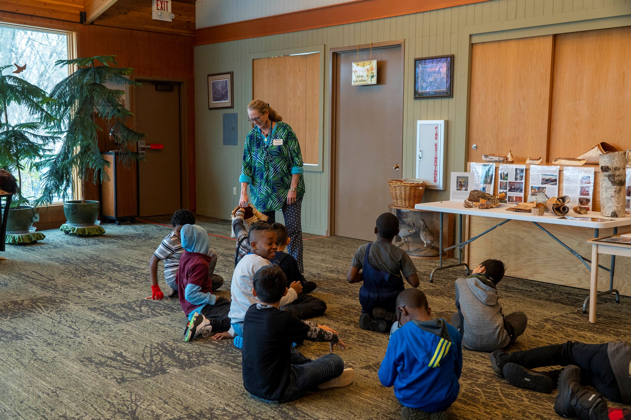 Students watch and participate in an activity.