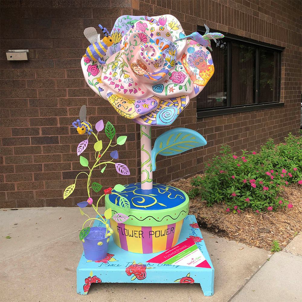 A Roseville in Bloom statue: Flower Power by Wendy McCarty.