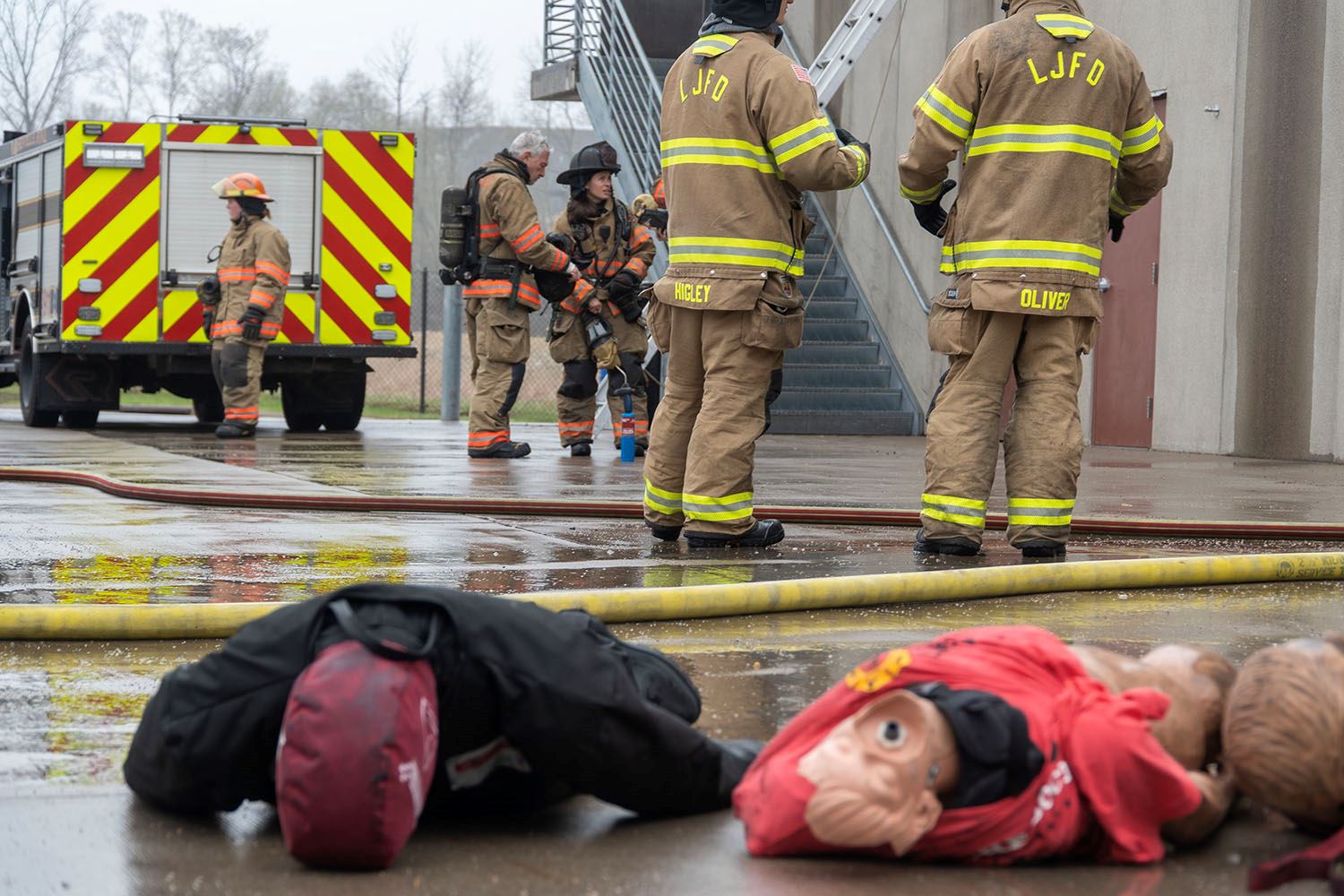 Firefighters debrief after fire rescue trainings.