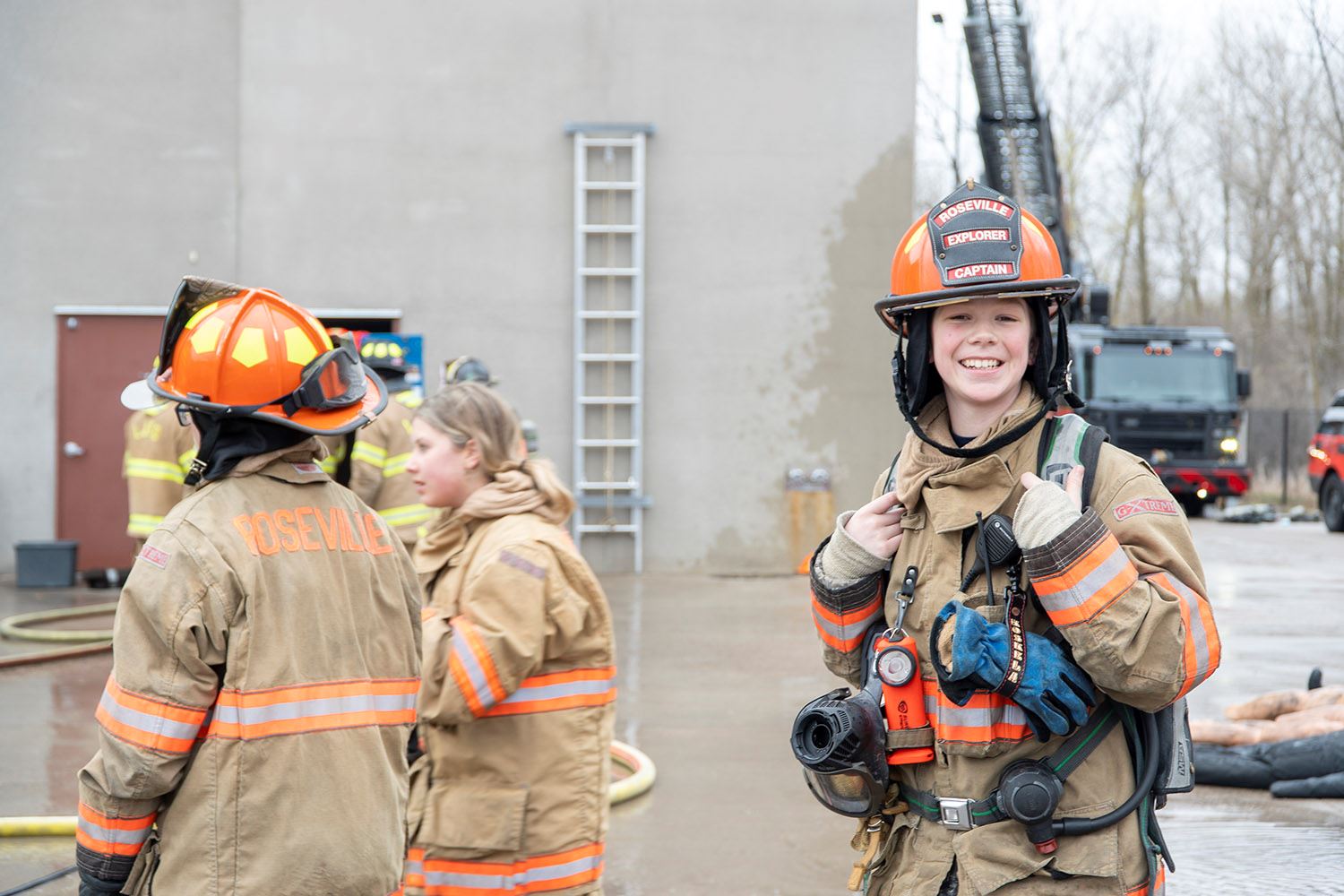 Roseville Fire Explorers help during a live burn training.