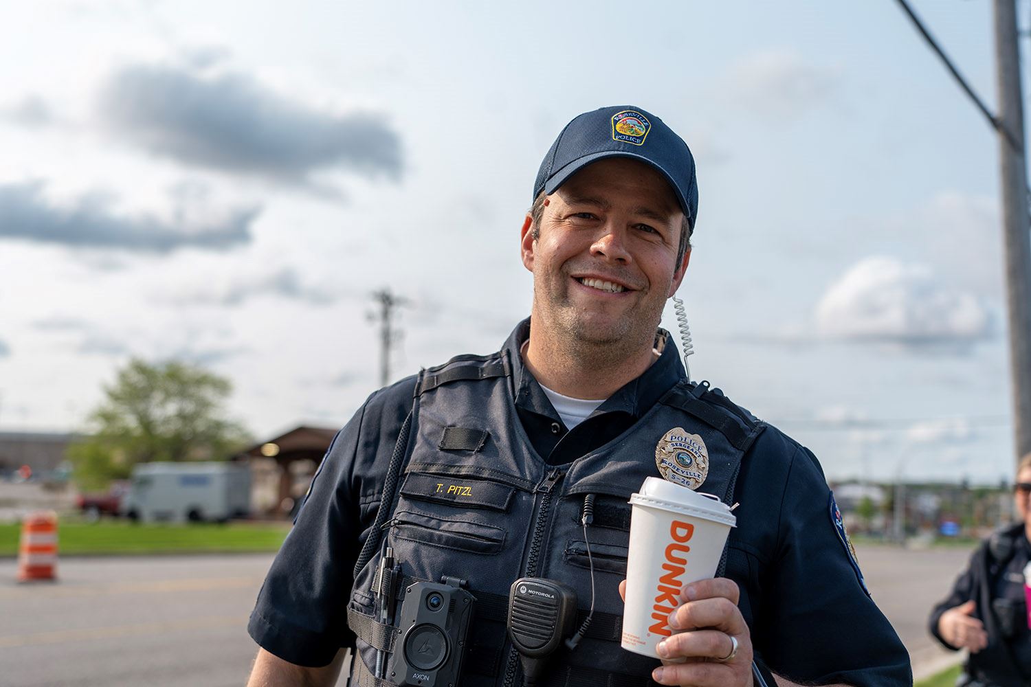 Tom Pitzl smiles at the Cop on a Rooftop event.