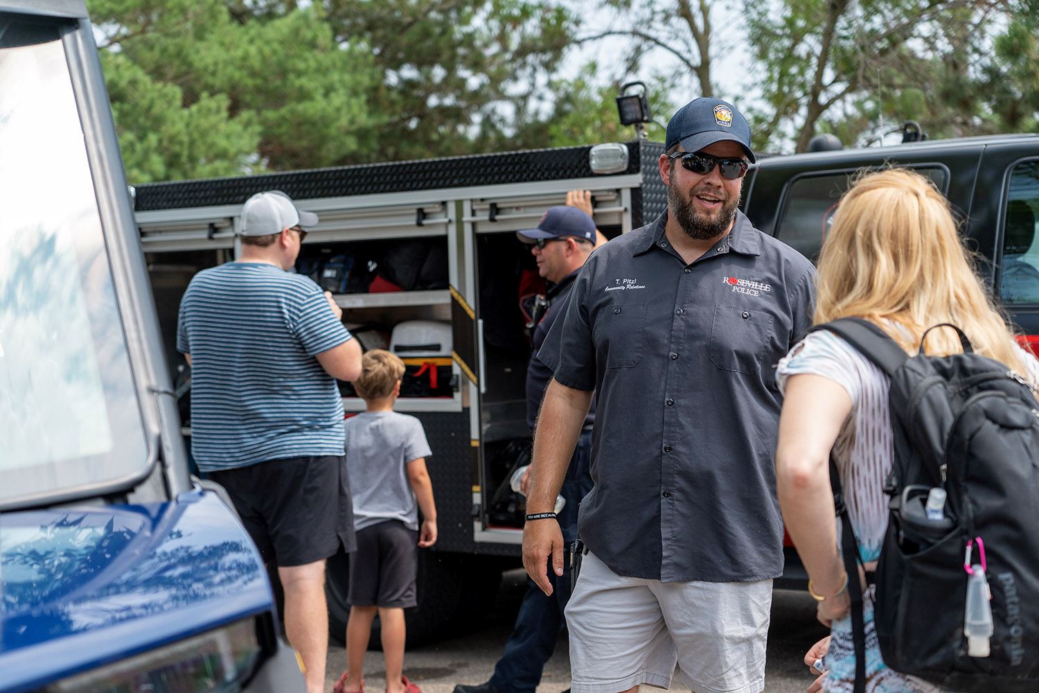 Community Relations Specialist Tom Pitzl talks with community members.