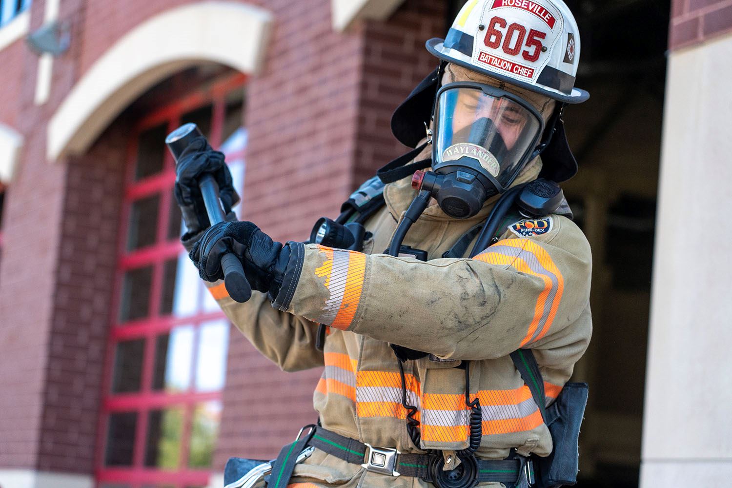 A firefighter works on functional fitness activities.
