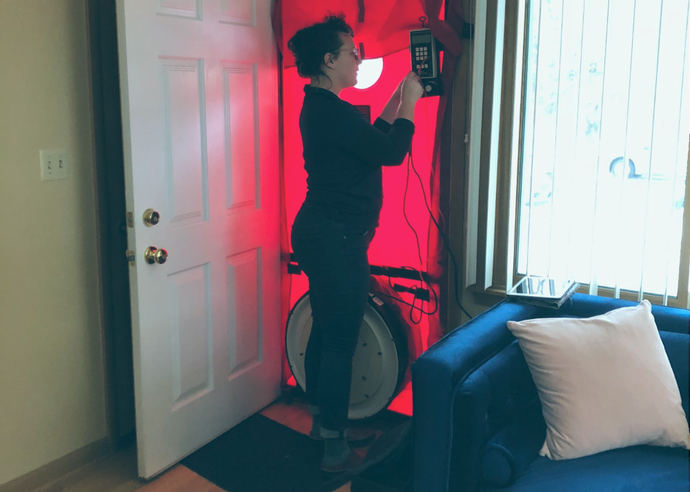 A Home Energy Squad employee inspects a home.